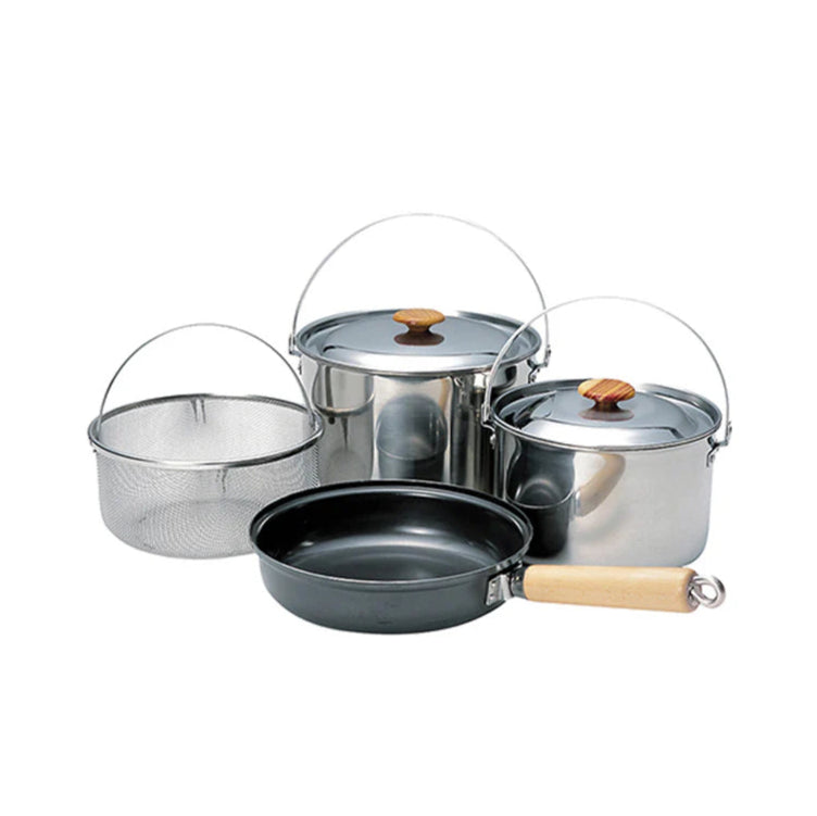 Set of stainless steel cookware with lids on a white background